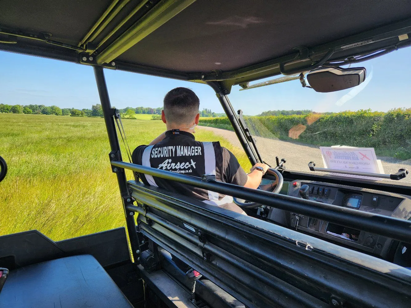 Airsec security manager driving an event vehicle during operations